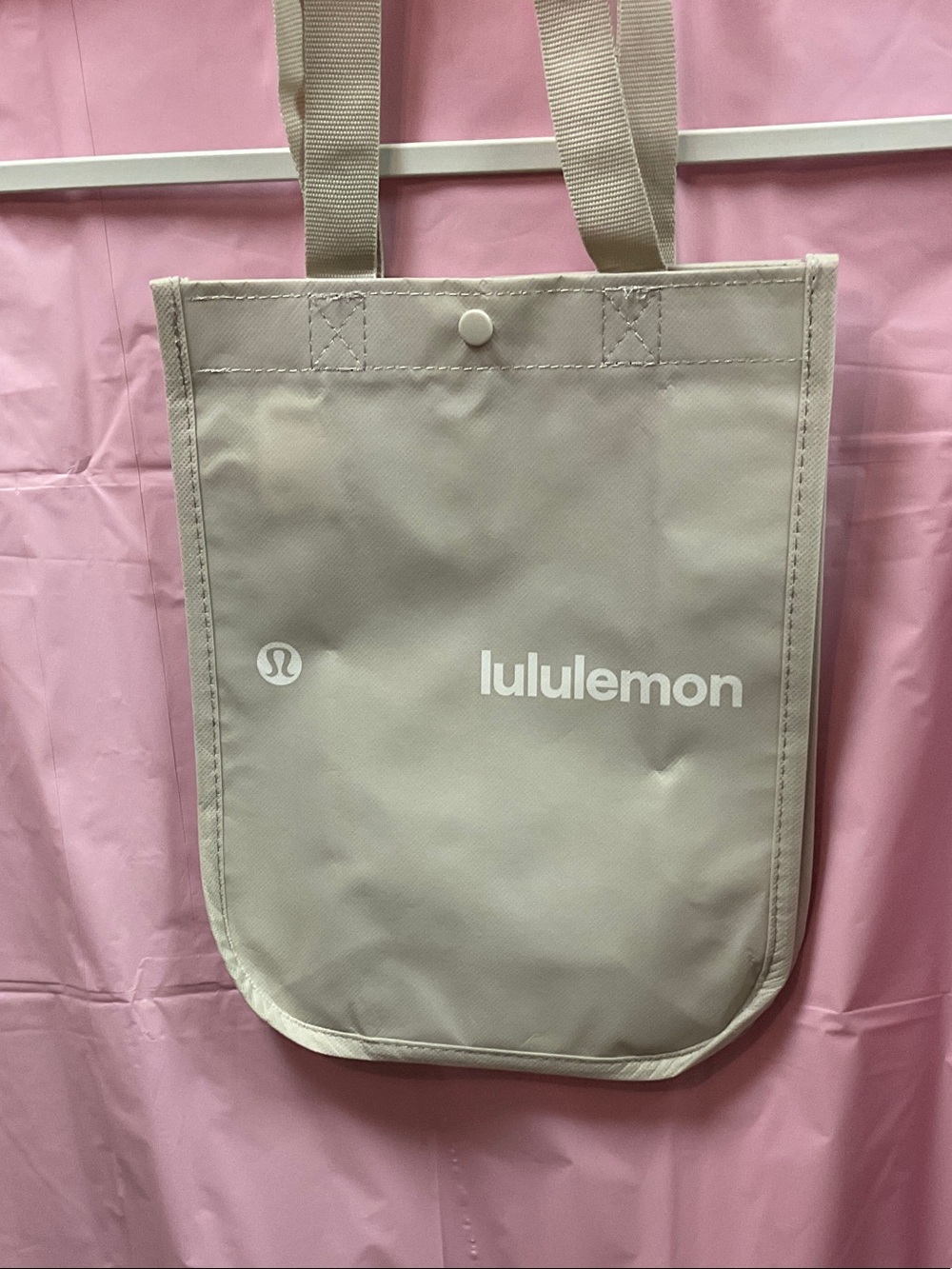 Small lululemon athletica light beige tote with white logo